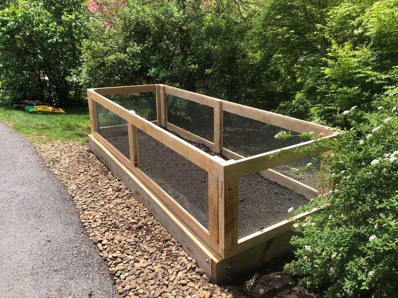 Raised bed with attached fencing