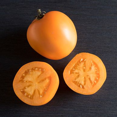 Picture of orange slicer tomato sliced in half